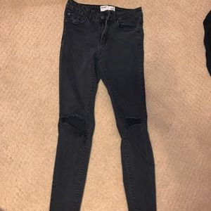 Garage size 7 black ripped jeans